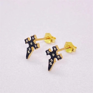 Macro shot of S925 silver cross stud earrings with black matte finish and small white diamonds