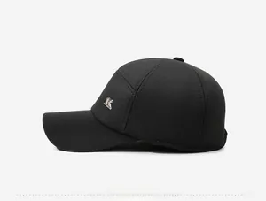 Detail view of winter baseball cap showing side profile and silver metal letter K logo