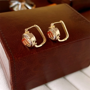 Golden square hoop earrings with round zircon inlay and red 'm' letter detail