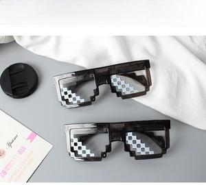 Macro view of two pairs of black pixel mosaic sunglasses in iconic Thug Life style