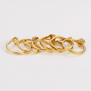 Detailed view of 6-piece gold stainless steel ring set with geometric star and heart patterns