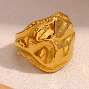 Macro shot of gold-plated stainless steel ring with 18K irregular rock-like texture