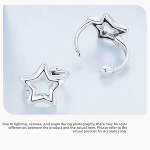 Detailed macro view showing the S925 hallmark on polished silver star-shaped hoop earrings