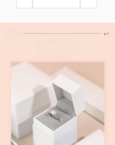 Detailed view of white textured paper jewelry box with grey velvet lining for bracelets