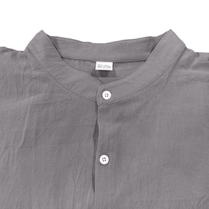 Close-up of the standing collar and button placket on a men's grey linen-cotton shirt