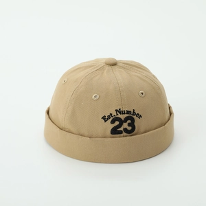 Detail of khaki cotton docker hat for kids with Est. Number 23 embroidery and air holes
