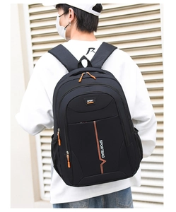 Rear view of black backpack with orange zippers and sport lettering on a model