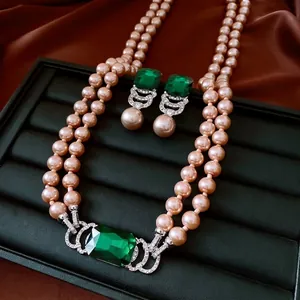 Vintage jewelry set with green square pendants and double-layered pearl necklace