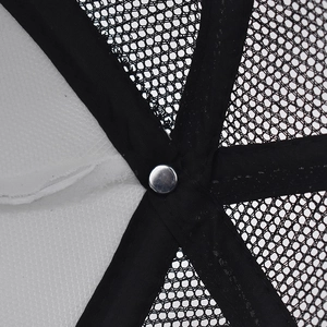 Macro shot of trucker hat interior featuring reinforced black tapes and central metal rivet