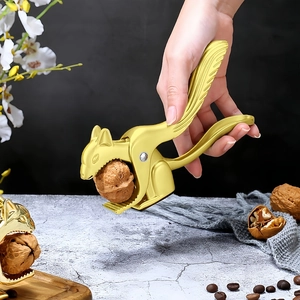 Detailed close-up of a golden squirrel-shaped nutcracker made of durable zinc alloy