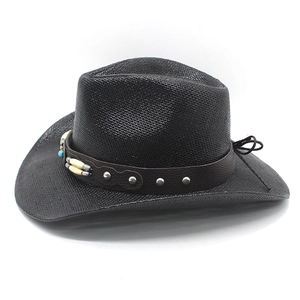 Detail of woven black cowboy hat with leather band featuring turquoise and metal studs
