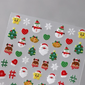 3D embossed Christmas nail art stickers featuring Santa, snowmen and reindeer icons