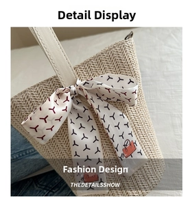 Detailed close-up of cream woven straw tote bag with decorative printed silk scarf handle