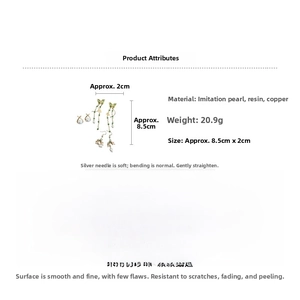 Detailed view of long butterfly pearl earrings with size 8.5cm and material specs