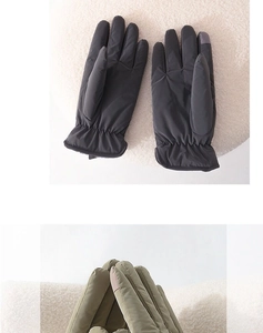 Detailed view of warm winter gloves in dark grey and green with elastic cuffs
