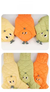 Detailed view of quilted pet vests in fruit designs with cute 3D stem and leaf details