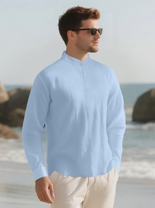 Macro shot of light blue linen shirt showing standing collar and high-quality fabric texture