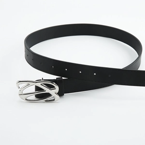 Flat lay of black leather belt featuring a hollow silver geometric metal buckle