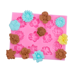 Pink silicone flower mold for DIY fondant and chocolate featuring rose and daisy shapes