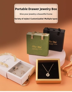 Detailed view of luxury drawer jewelry boxes with silk handles and plush velvet inserts