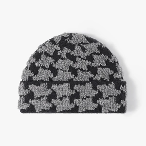 Women's winter knit beanie in black and grey jacquard pattern with thick folded cuff