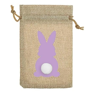 Detail of burlap Easter bag with purple rabbit silhouette and white plush tail pompom