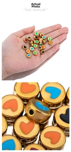 Macro detail of colorful enamel heart beads in gold finish for DIY jewelry crafting