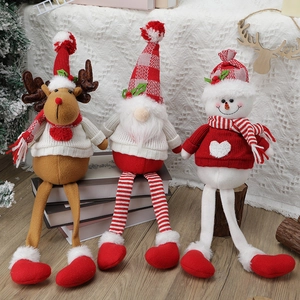 Three Christmas long-legged gnomes with reindeer and snowman on a wooden base