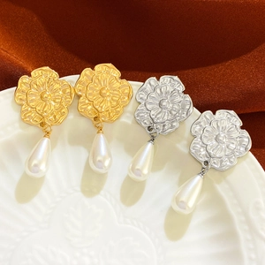 Retro flower pearl drop earrings set in gold and silver finish with petal relief design
