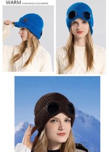 Close-up of winter knit beanie featuring integrated black goggles and warm fleece lining
