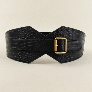 Close-up of black crocodile embossed corset belt with a large gold square buckle