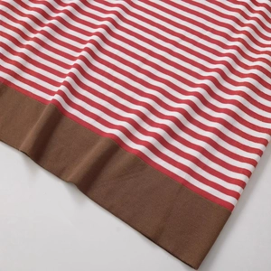 Loose-fit striped knit top with red and white stripes and brown ribbed hem detailing