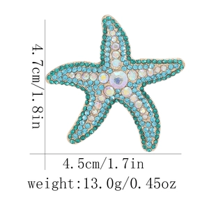Starfish brooch with blue rhinestones including dimensions 4.7cm by 4.5cm and 13.0g weight