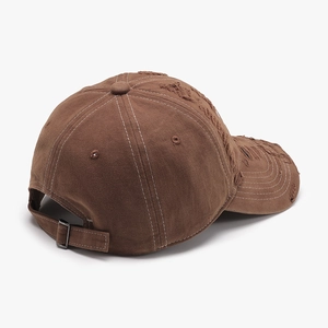 Vintage brown distressed baseball cap with embroidered letters and adjustable metal buckle