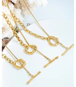Detailed view of dual-layer gold OT buckle necklace with liquid metal geometric pendant