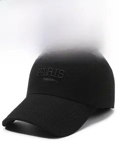 Detail of black baseball cap featuring 3D Paris embroidery and textured knit fabric