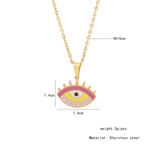 Detail view of pink and yellow enamel eye pendant on golden stainless steel chain