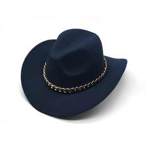 Detail of navy blue felt cowboy hat with upturned brim and gold chain band ornament