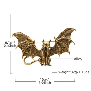 Retro winged cat brooch in bronze gold finish with gothic bat wing design details