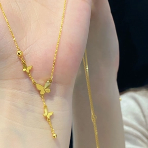 18K gold plated titanium necklace featuring butterfly pendants and elegant tassel fringe