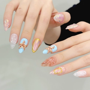 Handmade ocean-themed press-on nails with 3D starfish, pearls, and aurora shells