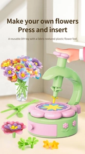 Detailed view of the DIY flower bouquet maker kit including press machine and colorful petals