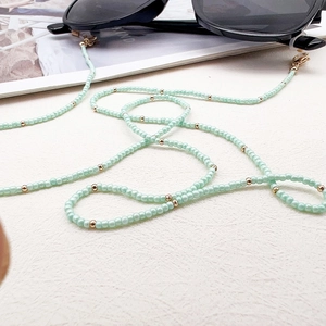 Mint green glass seed bead glasses chain with gold spacers and lobster clasps