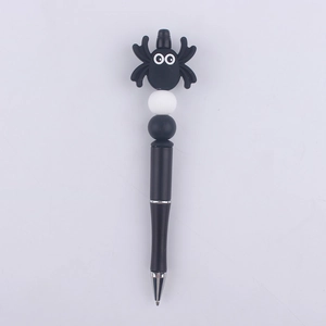 Detail of creative DIY beaded pen featuring a cute cartoon spider and silicone beads