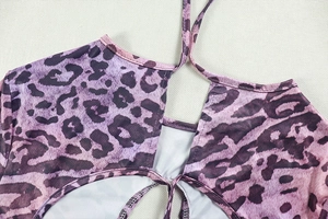 Close-up of the lace-up detail and purple leopard print on this backless jumpsuit