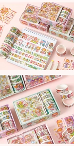 Close-up of cute cartoon washi tape rolls and stickers set in a spiral notebook layout