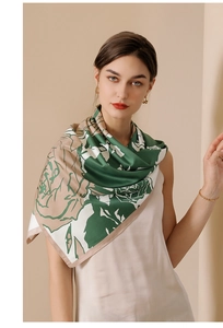 Detail of satin floral scarf showing large abstract roses in green and beige silk texture