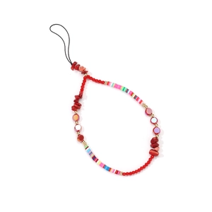 Detailed shot of handmade colorful beaded phone charm with acrylic and soft clay beads
