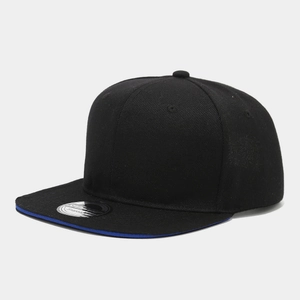 Detail view of black snapback hat with blue brim piping and silver round sticker