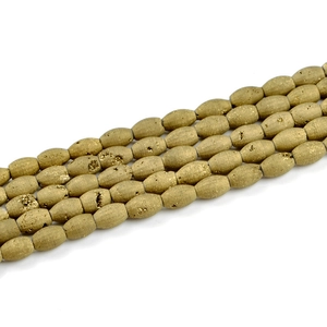 Macro detail of golden oval druzy agate beads with natural sparkling crystal texture